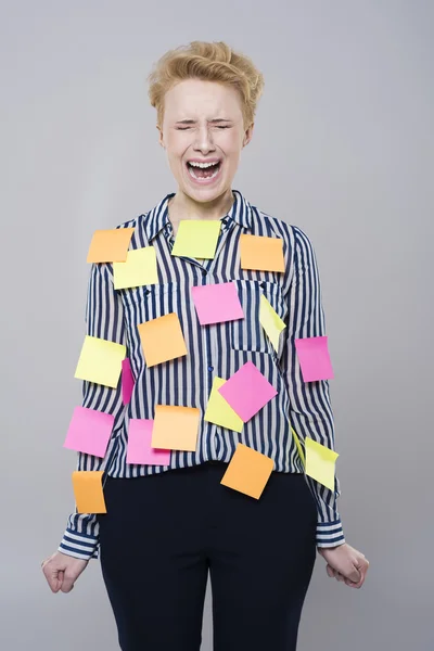 Woman standing with sticky notes