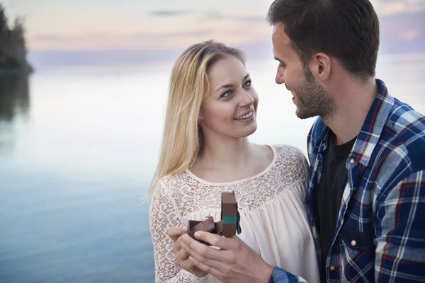 Romantic man proposing to a woman