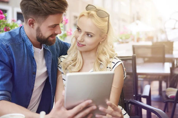 Couple using digital tablet