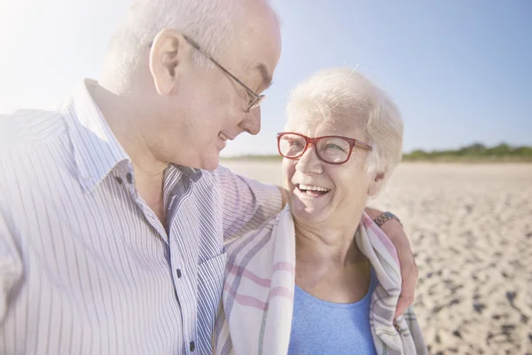 Senior couple having a walk on the beach