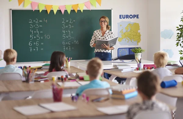 Teacher during the lesson with kids