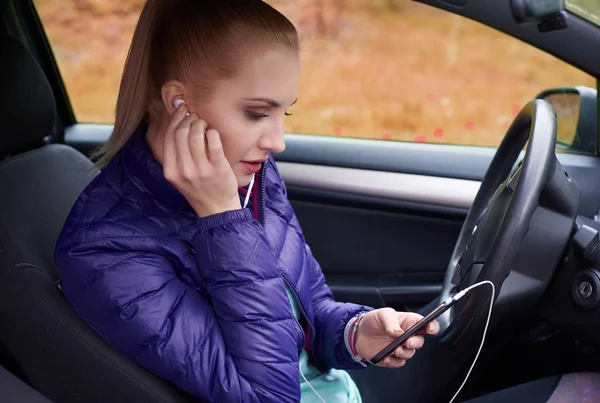 Woman listening to music in the car