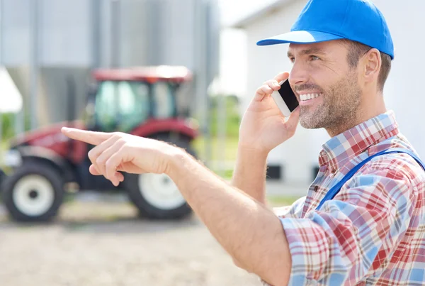 Farmer talking on the mobile phone
