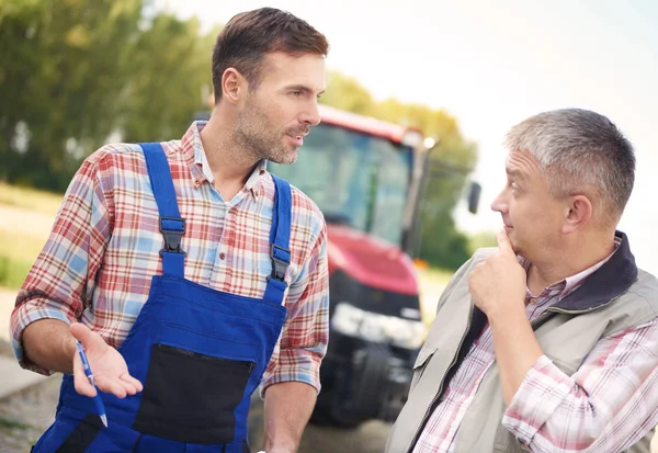 Discussion between two modern farmers