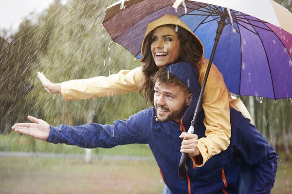 Loving couple in rain