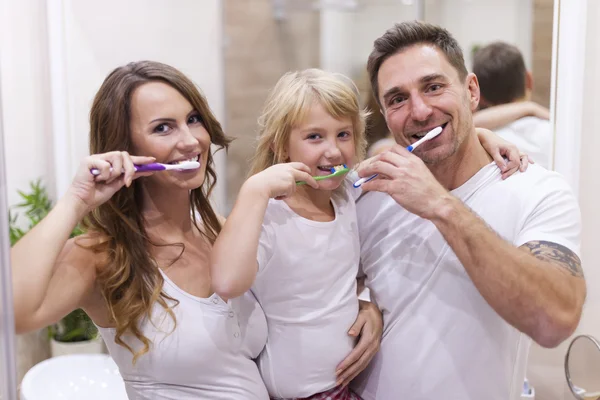 Family brushing teeth