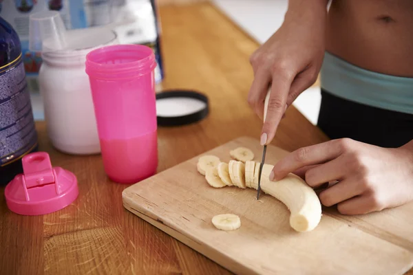 Woman Preparing bananas shake