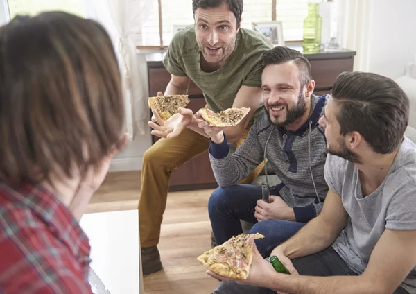 Funny men eat pizza