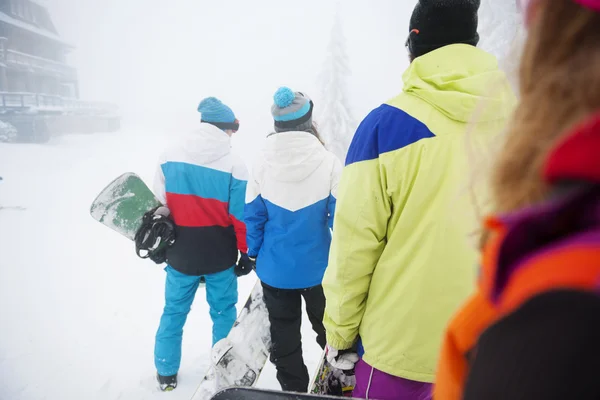 Best friends Preparing for snowboarding