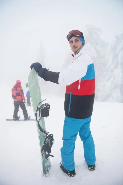 Man snowboarding in mountains