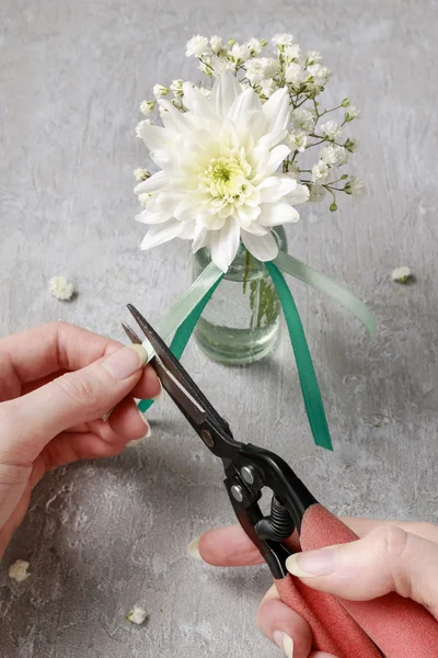 Florist at work. How to make napkin ring with chrysanthemum flow