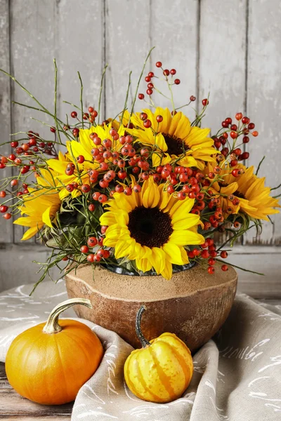Florist at work: how to make floral arrangement with sunflowers