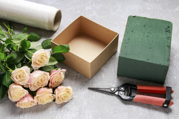 Florist workplace: how to make box with flowers, step by step