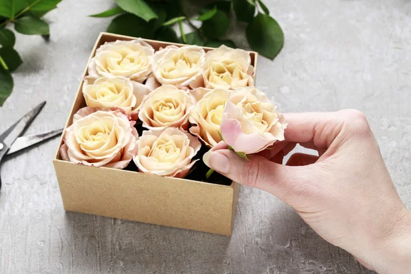 Florist workplace: how to make box with flowers, step by step