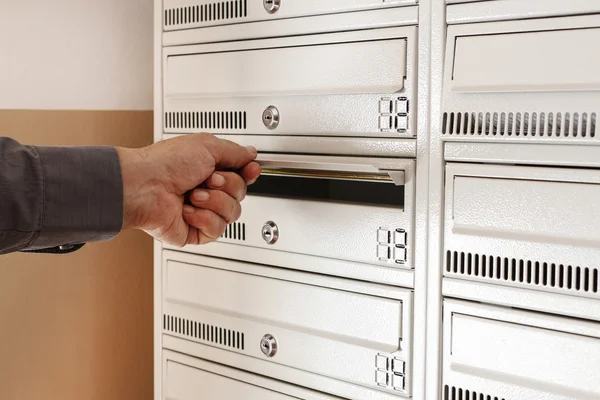 Man checking his mailbox for a new letters