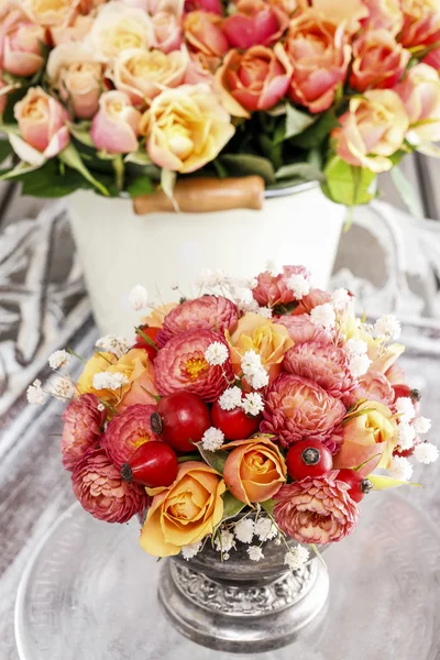Florist at work: How to make bouquet of roses and chrysanthemums