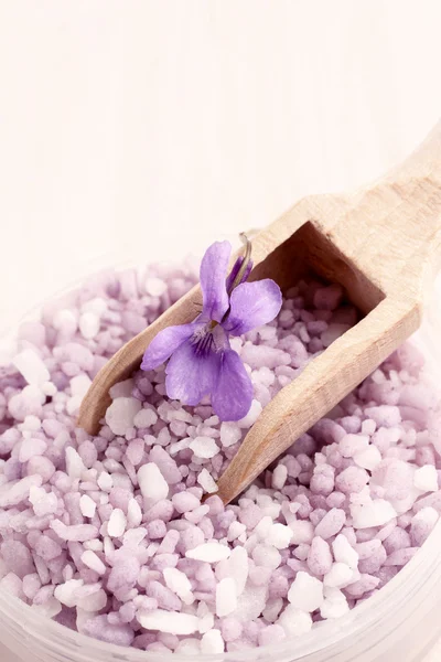 Sea salt with viola flowers (viola odorata)