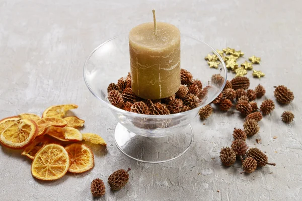 How to make candle holder decorated with cones and dried fruits.