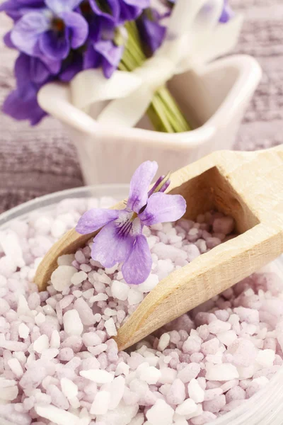 Sea salt with viola flowers (viola odorata)