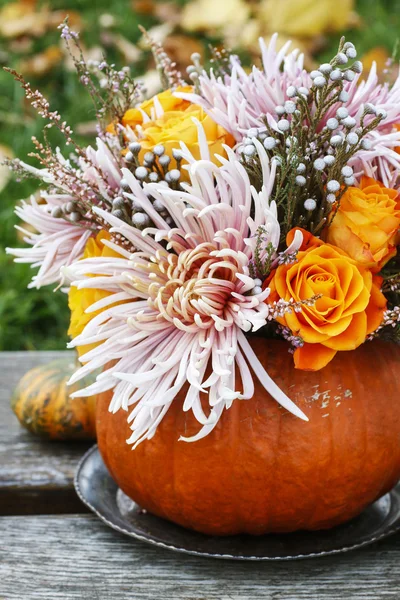 Bouquet of flowers in pumpkin