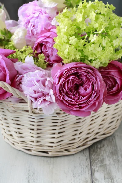 Floral arrangement with pink roses, peonies and matthiola flower