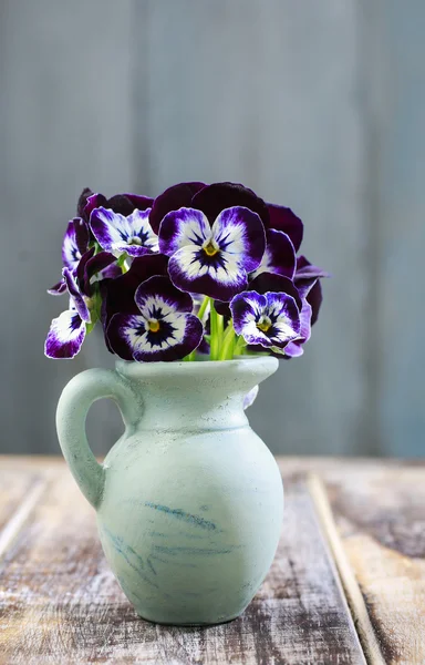Bouquet of pansy flower in ceramic vase
