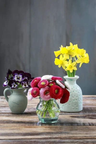 Bouquet of pansy flowers in ceramic vase, bouquet of red daisies