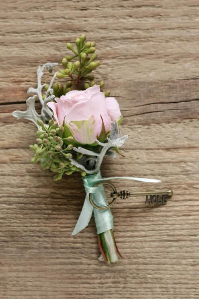 Wedding boutonniere with pink rose