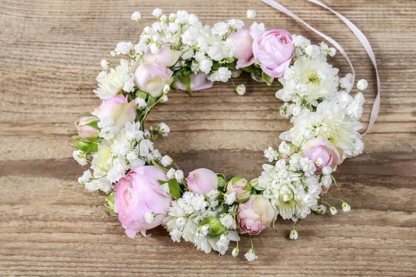 Florist at work. Steps of making wedding wreath