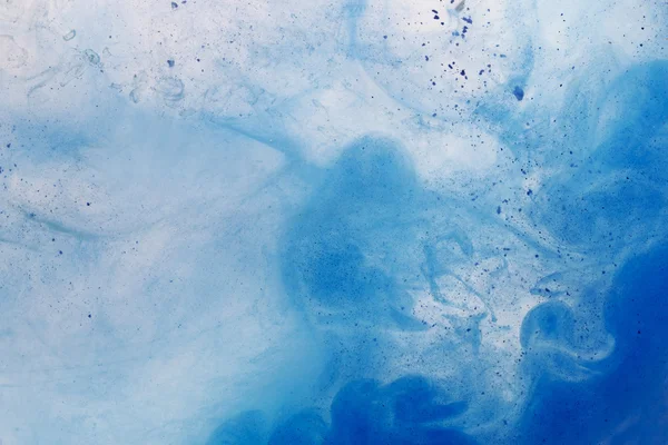 Paint in water - abstract background