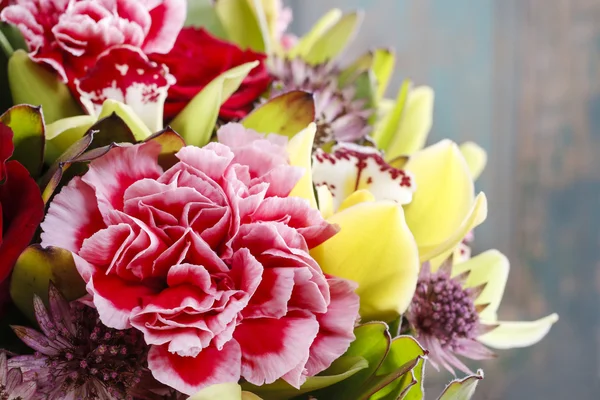 Bouquet of orchid, rose and carnation flowers