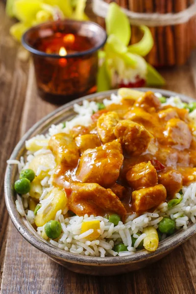 Chicken curry with basmati rice and green peas
