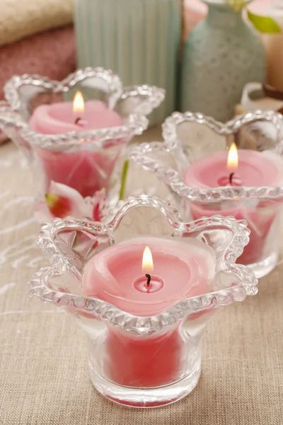 Pink scented candles in glass candle holders