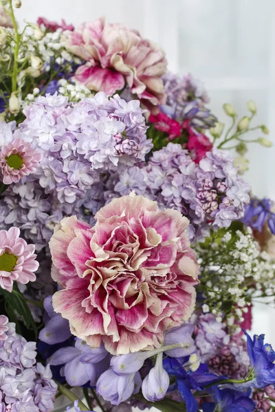 Bouquet of carnations, lilacs and chrysanthemums