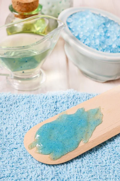 Blue body scrub and other spa cosmetics