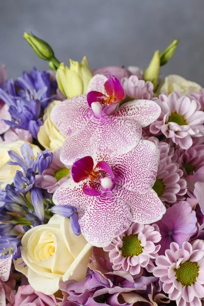 Lovely bouquet of pink orchids, chrysanthemums and hortensias