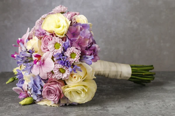 Bouquet of pink orchids, chrysanthemums and hortensias mixed wit