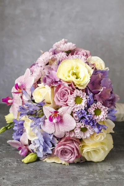 Bouquet of pink orchids, chrysanthemums and hortensias mixed wit