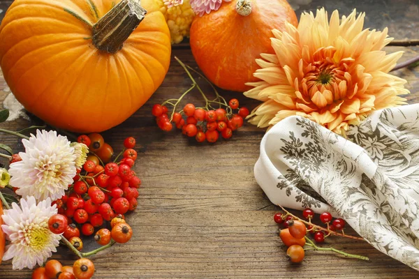 Autumn background with fruits and flowers