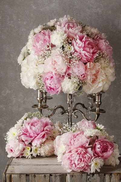 Floral arrangement with pink peonies, white chrysanthemums and g