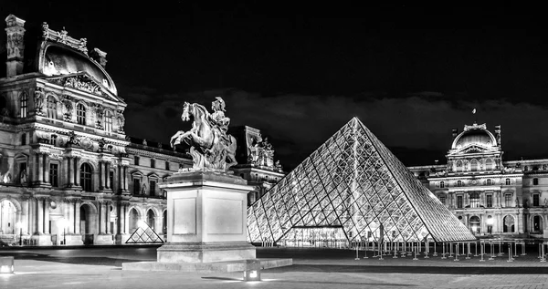 Night view of  Louvre- museum in Paris , France - Stock Editorial Photography