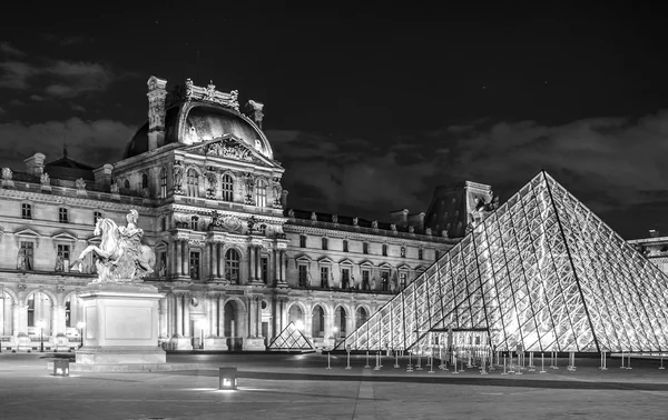 Night view of  Louvre- museum in Paris , France .