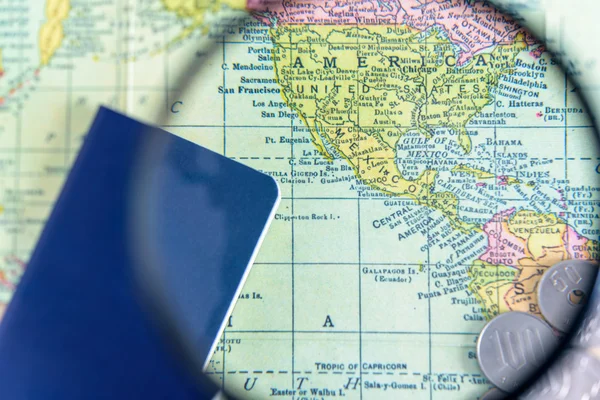 Magnifier and blur passport on world map background
