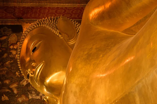 Close up Reclining Buddha gold statue. Wat Pho, Bangkok, Thailan