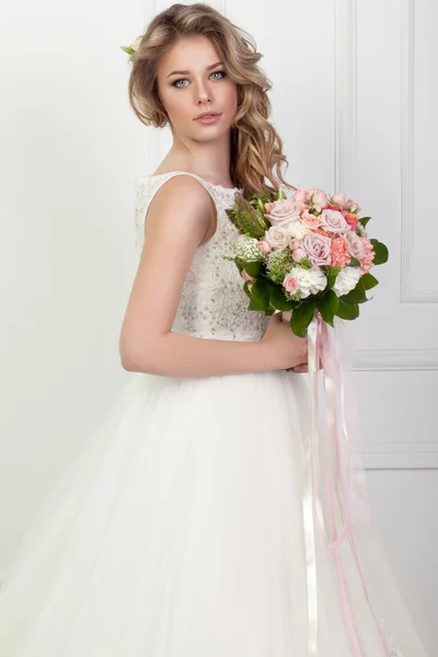 Beauty woman with wedding hairstyle and makeup. Bride fashion.