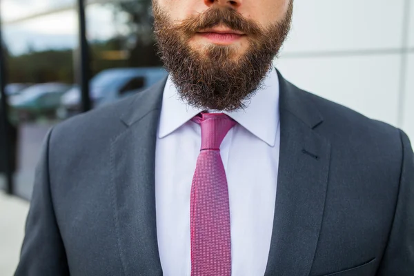 Portrait of a young bearded businessman. Close up.