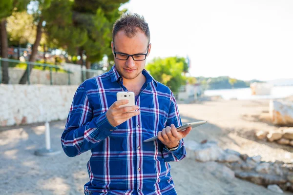 Tourist  with mobile tablet pc and mobile