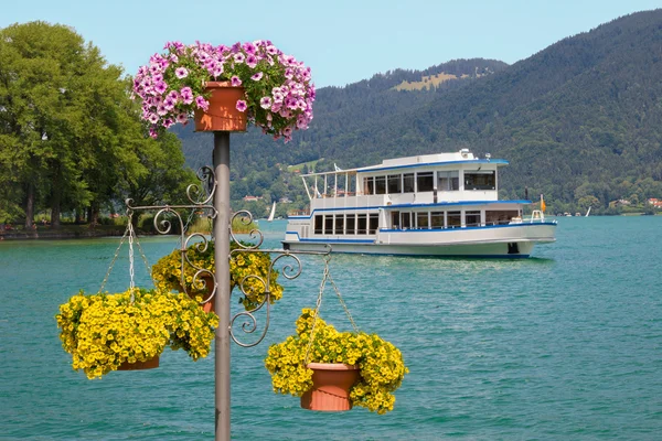 Passenger liner in bad wiessee harbor and summer flowers at lake
