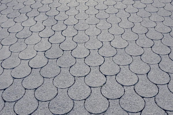 Pavement with fish scale pattern