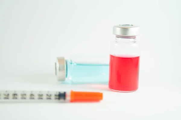 Disposable syringe and injection vial background